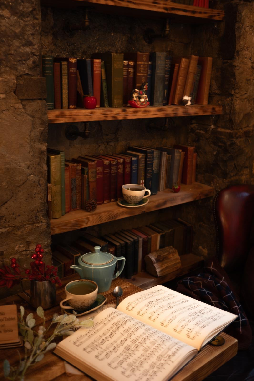 Cosy bookshelf reading nook at Books N' Cup Tollcross